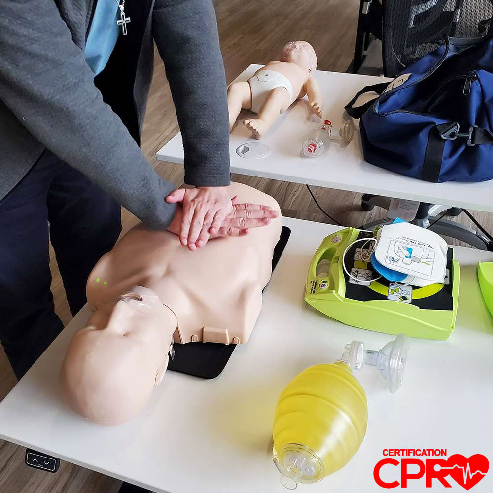 CPR training on mannequin for certification in Orlando.