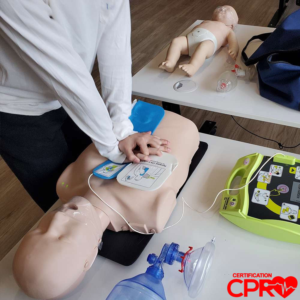 CPR training with mannequin and AED for certification in Orlando.