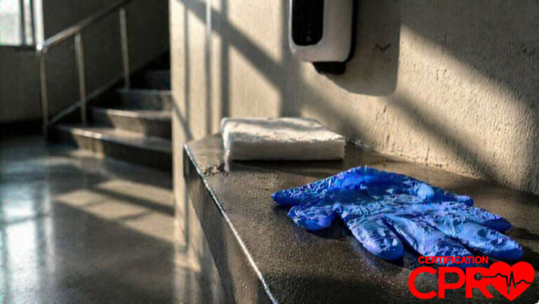 CPR training gloves and mask on a training station in Orlando.