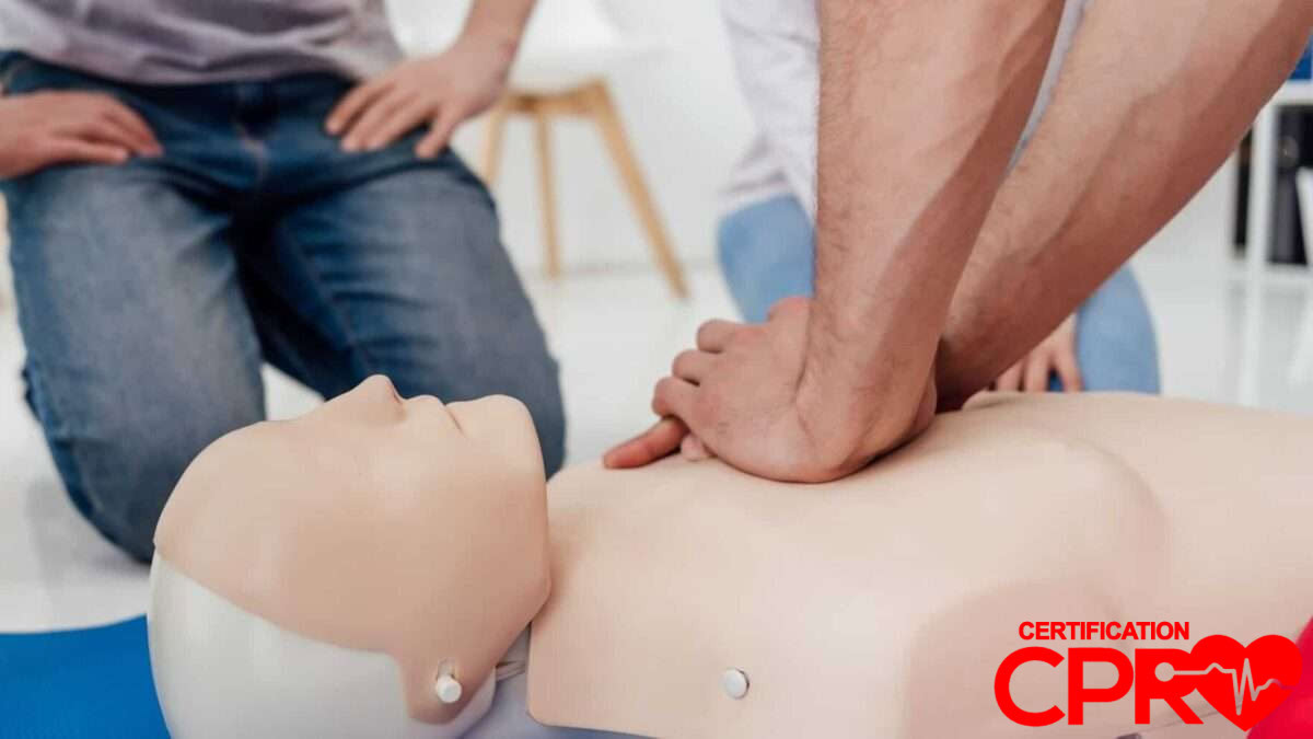 CPR training session with a man practicing on a mannequin in Orlando.